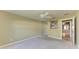 Neutral bedroom with carpet, ceiling fan, and a mirrored closet at 11624 Garessio Ln, Sarasota, FL 34238
