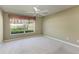 This bedroom offers neutral paint, carpet and great natural light at 11624 Garessio Ln, Sarasota, FL 34238
