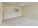 A clean bedroom featuring neutral tones and a ceiling fan at 11624 Garessio Ln, Sarasota, FL 34238