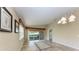 Bright dining room with tile floors, backyard views, and decorative lighting at 11624 Garessio Ln, Sarasota, FL 34238