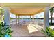 Lake view from lakeside gazebo showing seating with beautiful lake and blue sky at 11624 Garessio Ln, Sarasota, FL 34238