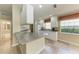 Beautiful kitchen with a center island, lots of counter space, and white cabinets at 11624 Garessio Ln, Sarasota, FL 34238