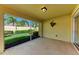 A cozy screened-in lanai overlooking the backyard at 11624 Garessio Ln, Sarasota, FL 34238