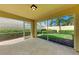 Screened-in lanai overlooking a lushly landscaped backyard at 11624 Garessio Ln, Sarasota, FL 34238