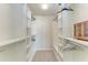 A well-organized walk-in closet featuring white shelving and ample storage space at 11624 Garessio Ln, Sarasota, FL 34238