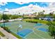 Outdoor basketball court featuring hoops, painted lines, and nearby community pool, offering a recreational space at 11986 Granite Woods Loop, Venice, FL 34292