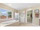 Bright bathroom with a large soaking tub, glass shower, and access to a walk-in closet at 11986 Granite Woods Loop, Venice, FL 34292