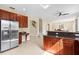This is a view of a Kitchen and transition to a dining room at 11986 Granite Woods Loop, Venice, FL 34292