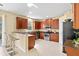 Well-equipped kitchen featuring stainless steel appliances, granite countertops, and ample cabinet space at 11986 Granite Woods Loop, Venice, FL 34292