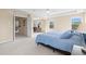 Large main bedroom with plush carpet is spacious and bright at 11986 Granite Woods Loop, Venice, FL 34292