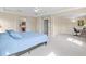Spacious main bedroom with plush carpet opens to an office with a desk and chair at 11986 Granite Woods Loop, Venice, FL 34292