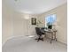 Home office offers a spacious desk, computer, and chair and a bright window at 11986 Granite Woods Loop, Venice, FL 34292