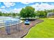 Community playground featuring modern equipment, swings, and soft ground cover, offering a fun and safe environment at 11986 Granite Woods Loop, Venice, FL 34292
