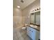 Bathroom features white cabinets, tile floors and shower/tub combo at 1204 L Pavia Blvd # 1204, Venice, FL 34292