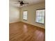 Bedroom features wood floors, two windows and neutral walls at 1204 L Pavia Blvd # 1204, Venice, FL 34292