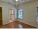 Bedroom featuring wood floors, a ceiling fan and an ensuite bathroom at 1204 L Pavia Blvd # 1204, Venice, FL 34292