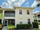 Condominium building showing manicured landscape, white trim, with a private screened-in balcony at 1204 L Pavia Blvd # 1204, Venice, FL 34292