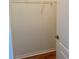 A walk-in closet space with a wire shelf for simple storage and a wooden floor at 1204 L Pavia Blvd # 1204, Venice, FL 34292