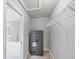 Spacious walk-in closet featuring wire shelving, carpet, and a security safe at 1228 Pineland Ave, Venice, FL 34285