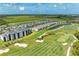 Expansive aerial view of golf course community with multiple lakes and lush greenery at 12390 Wellen Golf St # 203, Venice, FL 34293