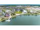 An aerial view featuring a lakefront community with waterfront amenities and modern architecture at 12390 Wellen Golf St # 203, Venice, FL 34293