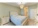 Calm bedroom featuring neutral decor, a cozy bed, and matching dresser and nightstand set at 12390 Wellen Golf St # 203, Venice, FL 34293