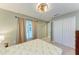 Bedroom with closet and large window showing natural light at 12390 Wellen Golf St # 203, Venice, FL 34293