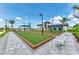 Well-maintained bocce ball courts, complemented by inviting benches and scenic landscaping for leisure activities at 12390 Wellen Golf St # 203, Venice, FL 34293