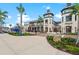 Attractive shopping plaza with multiple storefronts, paved walkways, and lush landscaping at 12390 Wellen Golf St # 203, Venice, FL 34293