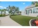 Attractive modern building with manicured lawn, landscaping, and a walkway at 12390 Wellen Golf St # 203, Venice, FL 34293