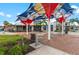 Outdoor seating area and modern retail storefronts, offering a vibrant and inviting commercial atmosphere at 12390 Wellen Golf St # 203, Venice, FL 34293