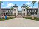 Shopping center featuring upscale storefronts, well-maintained landscaping, and pedestrian-friendly walkways at 12390 Wellen Golf St # 203, Venice, FL 34293