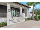 Beautifully designed building with classic black and white exterior and well-maintained landscaping at 12390 Wellen Golf St # 203, Venice, FL 34293