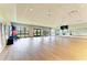 Spacious fitness center with hardwood floors, mirrored walls, and fitness equipment at 12390 Wellen Golf St # 203, Venice, FL 34293