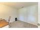 Cozy office space with desk, chair, and plush carpeting for a quiet work area at 12390 Wellen Golf St # 203, Venice, FL 34293