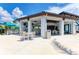 Inviting poolside bar and dining area with open-air seating, perfect for relaxation and socializing at 12390 Wellen Golf St # 203, Venice, FL 34293