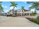 Beautiful retail area featuring palm trees, parking, and stylish storefronts for various businesses at 12390 Wellen Golf St # 203, Venice, FL 34293
