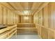 Wooden sauna with bench seating, providing a relaxing and therapeutic experience at 12390 Wellen Golf St # 203, Venice, FL 34293