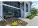 Picturesque outdoor screened lanai with seating area and manicured landscaping at 12390 Wellen Golf St # 203, Venice, FL 34293