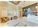 Elegant spa reception area with stylish seating, a modern desk, and decorative wall panels at 12390 Wellen Golf St # 203, Venice, FL 34293