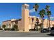 Exterior of the Venice Theatre on a clear day with blue skies and tall palm trees at 12390 Wellen Golf St # 203, Venice, FL 34293