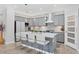 Stylish kitchen featuring an island with seating and stainless-steel appliances at 12871 Cinqueterre Dr, Venice, FL 34293