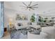 Bright living room boasting a comfortable sectional and elegant dining area at 12871 Cinqueterre Dr, Venice, FL 34293