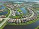 Amazing aerial view of a beautiful lake community with well-maintained homes at 13016 Rinella St, Venice, FL 34293