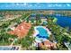 Breathtaking aerial view of resort style pool and recreational area near the lake at 13016 Rinella St, Venice, FL 34293