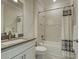 Clean bathroom with white cabinets, light grey countertop, and shower-tub combo at 13016 Rinella St, Venice, FL 34293