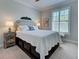 Cozy bedroom with neutral tones, a shuttered window, and decorative furniture at 13016 Rinella St, Venice, FL 34293