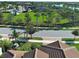 Beautiful Florida community featuring well-maintained lawns and many mature trees at 13016 Rinella St, Venice, FL 34293