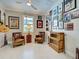 Relaxing den adorned with musical artwork, hardwood floors, and comfortable seating area at 13016 Rinella St, Venice, FL 34293