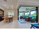 Dining room with a view of the lanai through large sliding glass doors at 13016 Rinella St, Venice, FL 34293